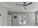 Neutral bedroom featuring a ceiling fan, and access to a balcony for outdoor enjoyment at 1431 Torrington Dr, Auburn, GA 30011