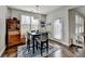 Cozy breakfast nook with natural light, modern decor, and view of backyard through large sunny windows at 1431 Torrington Dr, Auburn, GA 30011