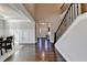 Grand foyer with hardwood floors, wainscoting, staircase, and a view of the front door at 1431 Torrington Dr, Auburn, GA 30011