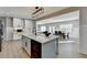 Bright kitchen featuring a large island, white cabinets, stainless steel appliances, and open layout at 1431 Torrington Dr, Auburn, GA 30011