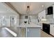 Bright kitchen featuring a large island, stainless steel appliances, and a modern design at 1431 Torrington Dr, Auburn, GA 30011