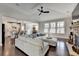 Spacious living room with a vaulted ceiling, fireplace, and open concept design at 1431 Torrington Dr, Auburn, GA 30011