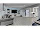 Finished basement living room with luxury vinyl flooring, built-in shelving and recessed lighting at 1431 Torrington Dr, Auburn, GA 30011