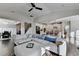 Bright, open living space with a large sectional couch and a view of the kitchen at 1431 Torrington Dr, Auburn, GA 30011