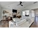 Open-concept living room with a fireplace, TV, and a view of the dining area at 1431 Torrington Dr, Auburn, GA 30011