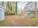 Expansive backyard with deck, grassy area, and mature trees at 1770 Lynn Ln, Decatur, GA 30032