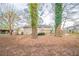 The backyard features a small deck, trees, and a shed, offering privacy and space for outdoor activities at 1770 Lynn Ln, Decatur, GA 30032