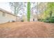 The backyard offers a deck, trees, and a storage shed, perfect for outdoor enjoyment and storage at 1770 Lynn Ln, Decatur, GA 30032