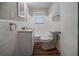 This bathroom features a granite countertop vanity, new toilet and tiled tub, offering a clean modern space at 1770 Lynn Ln, Decatur, GA 30032