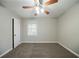 Comfortable carpeted bedroom with ceiling fan and ample natural light at 1770 Lynn Ln, Decatur, GA 30032