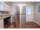 Well-lit kitchen features granite countertops, stainless steel appliances and wood flooring at 1770 Lynn Ln, Decatur, GA 30032