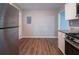 Stainless steel refrigerator and gas range, with wood flooring, in the spacious kitchen at 1770 Lynn Ln, Decatur, GA 30032
