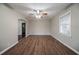Spacious living room boasts hardwood floors, ceiling fan and neutral paint color at 1770 Lynn Ln, Decatur, GA 30032