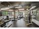 Well-equipped gym features treadmills, stationary bikes, weight machines, and large windows for natural light at 3235 Roswell Ne Rd # 710, Atlanta, GA 30305