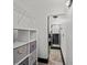 Hallway view to bathroom with a cubby system for organizing clothing or personal effects at 3235 Roswell Ne Rd # 710, Atlanta, GA 30305