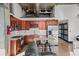 The charming kitchen features stainless steel appliances, ample counter space, and a view to the modern living area at 3235 Roswell Ne Rd # 710, Atlanta, GA 30305