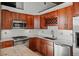 Kitchen area showcasing stainless steel appliances, granite countertops, white subway tile backsplash, and custom wooden cabinetry at 3235 Roswell Ne Rd # 710, Atlanta, GA 30305