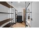 Bright walk-in closet with custom shelving and a modern barn door at 3235 Roswell Ne Rd # 710, Atlanta, GA 30305