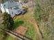 Aerial view of the home and a fenced backyard with mature trees at 4646 Breakwater Trl, Marietta, GA 30066
