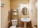 Cozy powder room with pedestal sink and decorative accents at 4646 Breakwater Trl, Marietta, GA 30066