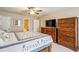 Bedroom with king bed, dresser, and ceiling fan at 4646 Breakwater Trl, Marietta, GA 30066