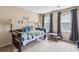Charming bedroom features a single bed, soft lighting, and whimsical nature-themed wall decorations at 4646 Breakwater Trl, Marietta, GA 30066