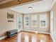 Cozy dining area with hardwood floors, backyard access, and large windows, adjacent to the kitchen at 4646 Breakwater Trl, Marietta, GA 30066