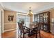 Dining room with hardwood flooring, chandelier, and cabinet at 4646 Breakwater Trl, Marietta, GA 30066