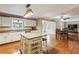 Bright kitchen with granite countertops, white cabinets, and hardwood flooring at 4646 Breakwater Trl, Marietta, GA 30066
