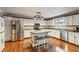 Well-lit kitchen with stainless steel appliances and hardwood floors at 4646 Breakwater Trl, Marietta, GA 30066