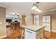 Bright kitchen with island, white cabinets, and hardwood flooring at 4646 Breakwater Trl, Marietta, GA 30066