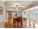 Open-concept kitchen and dining area with hardwood floors, stainless steel appliances, and natural light at 4646 Breakwater Trl, Marietta, GA 30066