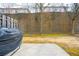 Flat backyard with a privacy fence, a retention wall, and a concrete patio at 805 Pleasant Hill Rd # 222, Lilburn, GA 30047