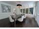 Dining room with hardwood floors, a modern chandelier, and lots of natural light at 9290 Waits Ferry Xing, Duluth, GA 30097