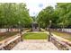 View of landscaped common areas with tennis courts, benches, statues, and a gazebo at 9290 Waits Ferry Xing, Duluth, GA 30097