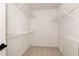 Walk-in closet with carpet and white wire shelving on every wall at 9290 Waits Ferry Xing, Duluth, GA 30097