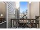 Cozy outdoor balcony with wooden table and chairs, perfect for relaxing or dining al fresco at 10 Colony Ridge Dr, Alpharetta, GA 30022