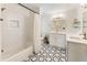 Modern bathroom with subway tile shower, stylish vanity with double sinks, and eye-catching black and white tile flooring at 10 Colony Ridge Dr, Alpharetta, GA 30022