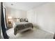 Comfortable bedroom with neutral carpet, double closet, and a cozy seating area with natural light from the window at 10 Colony Ridge Dr, Alpharetta, GA 30022