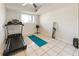 Basement exercise room with a treadmill, yoga mat, and a mirror for creating a functional workout space at 10 Colony Ridge Dr, Alpharetta, GA 30022