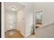 Bright foyer featuring wood-look floors, a coat closet, and an exterior view window at 10 Colony Ridge Dr, Alpharetta, GA 30022