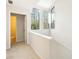 Upstairs hallway with plenty of natural light filtering through the adjacent windows and an open doorway at 10 Colony Ridge Dr, Alpharetta, GA 30022