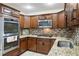 Well-appointed kitchen featuring granite countertops, tiled backsplash, and stainless-steel appliances at 10 Colony Ridge Dr, Alpharetta, GA 30022