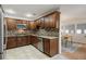 Modern kitchen featuring granite countertops, a stylish backsplash, and stainless-steel appliances at 10 Colony Ridge Dr, Alpharetta, GA 30022