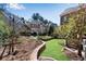 Landscaped backyard with manicured lawn, decorative stone pathways, and lush greenery, offering a peaceful retreat at 1029 Fairway Ne Ests, Atlanta, GA 30319