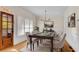 Elegant dining room featuring a dark wood table, upholstered chairs, and modern chandelier at 1029 Fairway Ne Ests, Atlanta, GA 30319