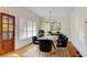 Elegant dining room featuring a glass table, velvet chairs, and modern chandelier at 1029 Fairway Ne Ests, Atlanta, GA 30319