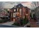 Elegant brick home with charming curb appeal, featuring a well-maintained yard, stone pathway, and inviting architecture at 1029 Fairway Ne Ests, Atlanta, GA 30319