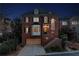 Stunning brick home at twilight showcasing architectural beauty, a well-lit entrance, and a cozy, inviting ambiance at 1029 Fairway Ne Ests, Atlanta, GA 30319