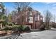 Brick home with traditional architectural details, a two-car garage, and a nicely landscaped front yard at 1029 Fairway Ne Ests, Atlanta, GA 30319